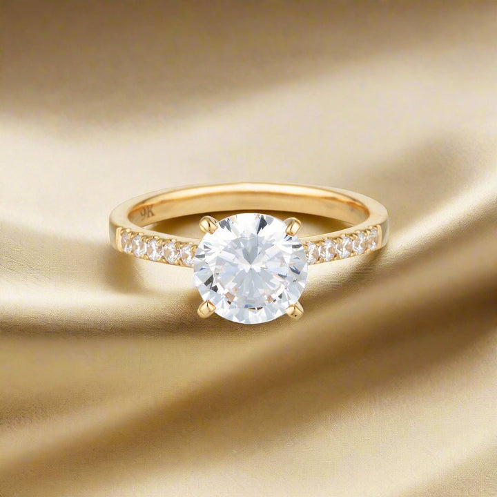 Georgini Gold Round Brilliant Cut 2ct Moissanite Engagement Ring In 9ct Yellow Gold